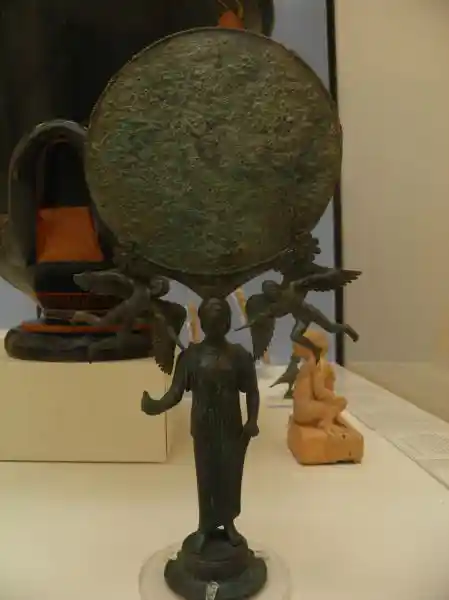 Mirror supported by a woman holding a dove